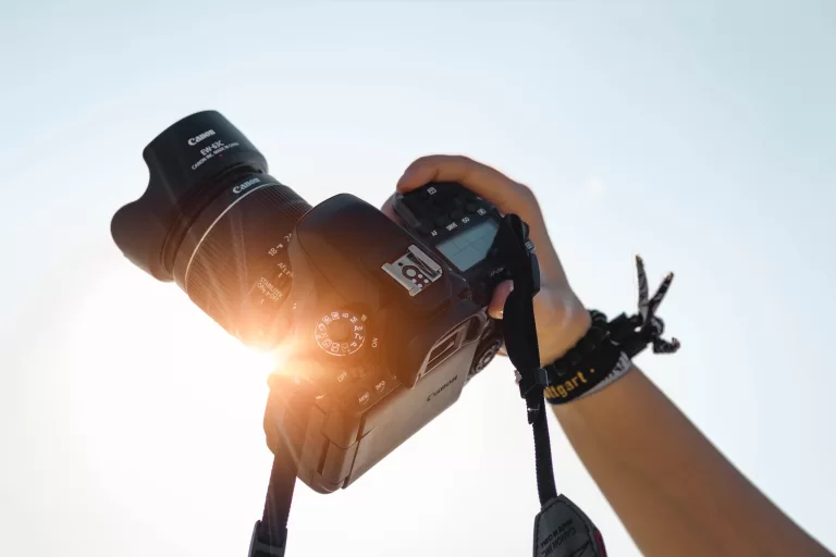 hand holding up a camera